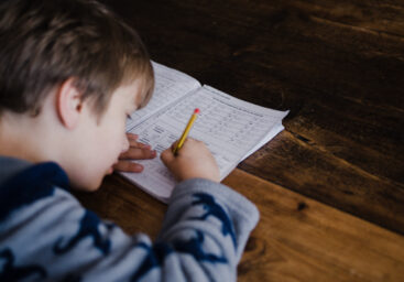 Kid doing schoolwork in what teachers and parents can do for anxiety at school