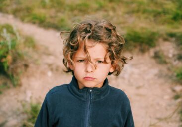 Boy looking at camera in training ground for self-regulation