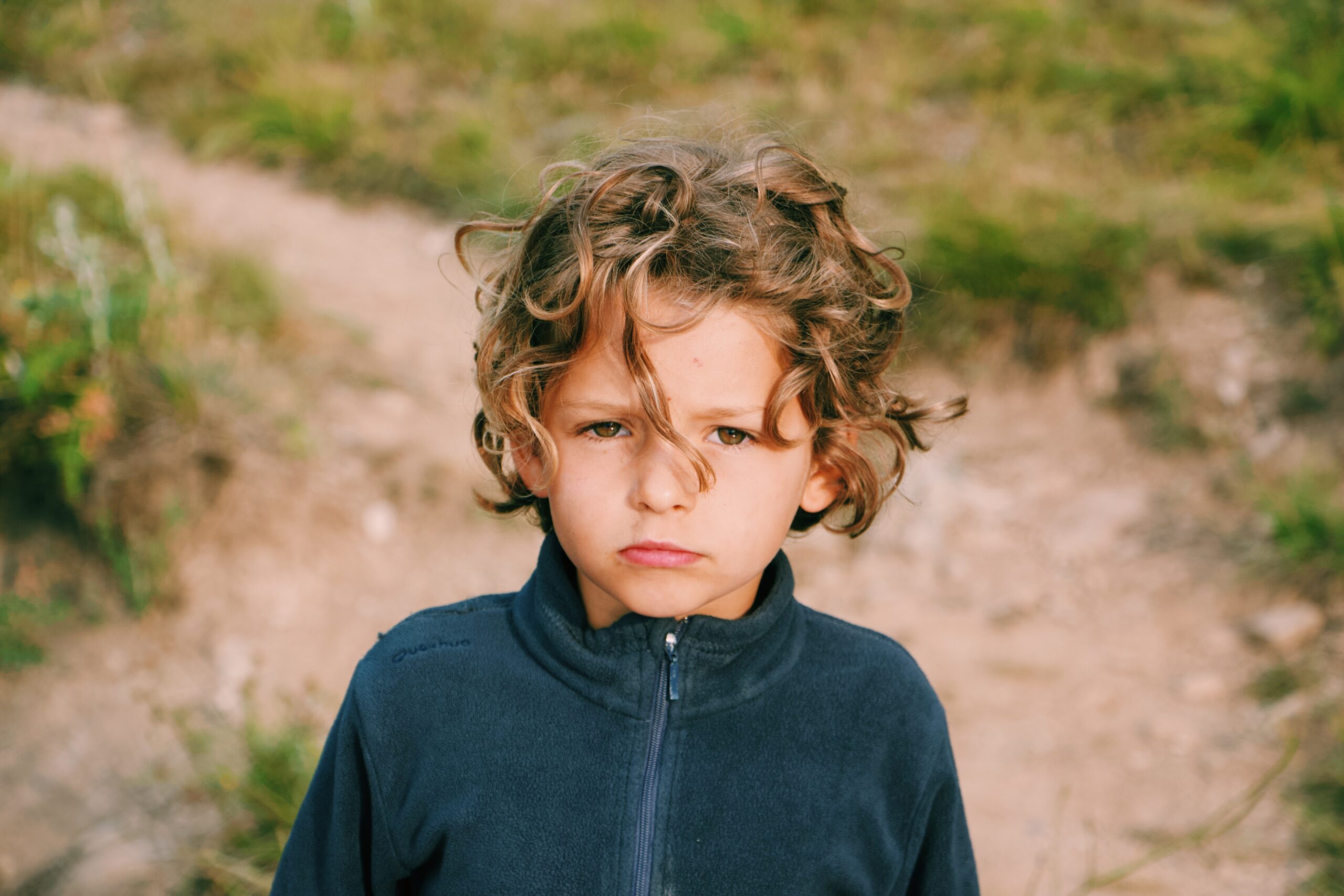 Boy looking at camera in training ground for self-regulation