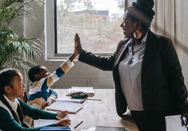 Teacher and Student in Classroom for learning, anxiety and relationship